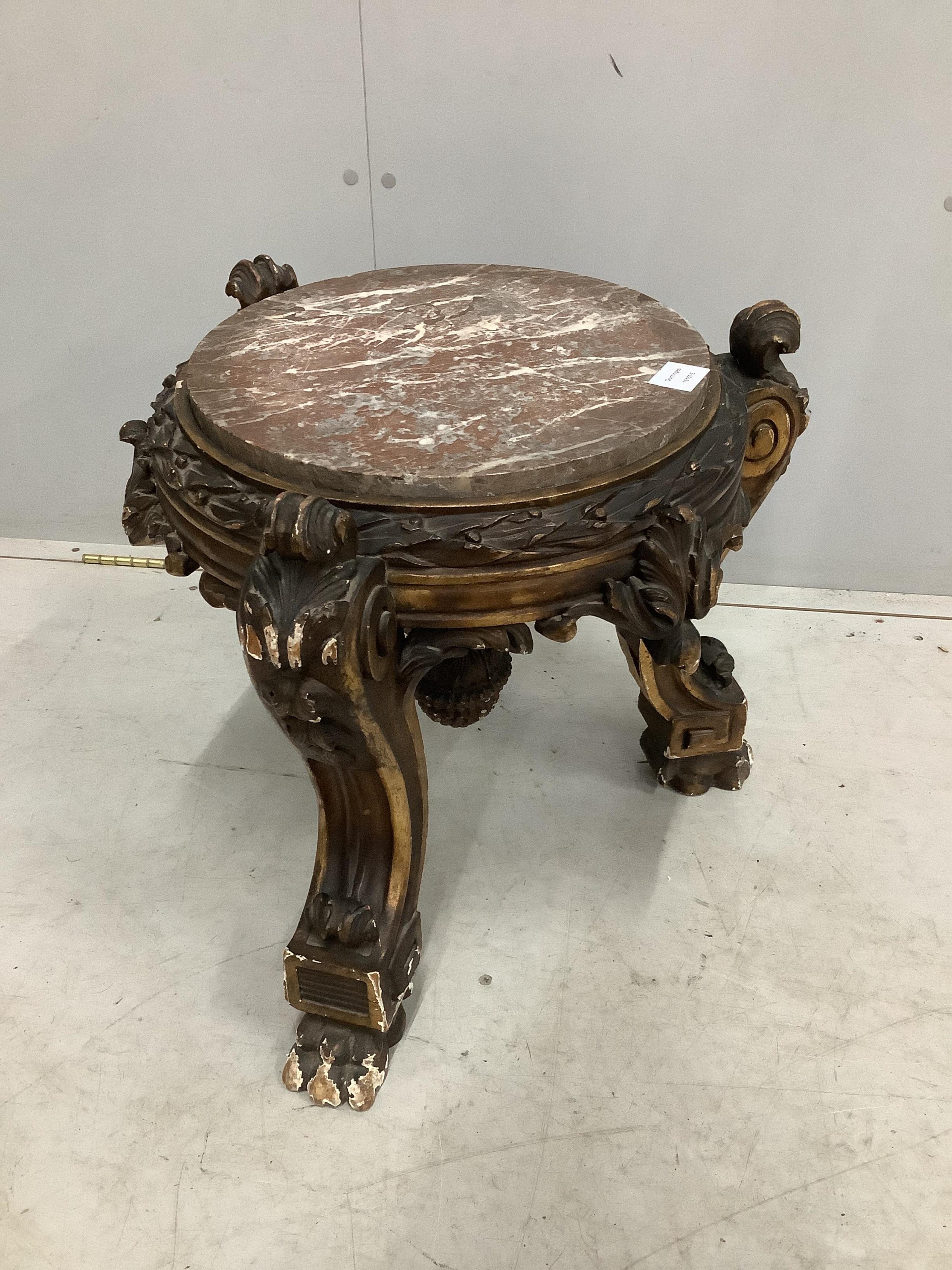 A 19th century carved parcel gilt and composition circular marble top low pedestal, diameter 54cm, height 47cm. Condition - fair to good